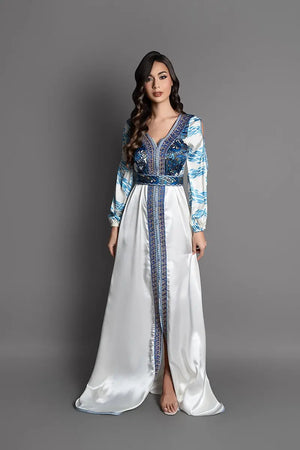 flowing blue and white Moroccan kaftan with bronze embroidery