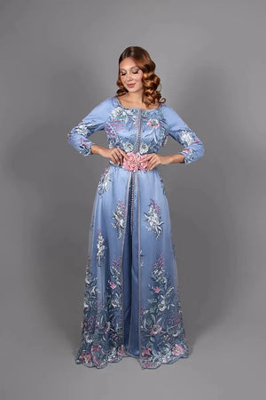 Moroccan kaftan with green pants and lace featuring pastel floral embroidery, pink floral belt, elegant Moroccan kaftan for weddings and ceremonies.
