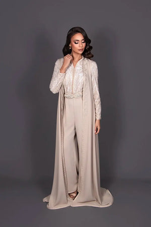 Two-fabric beige Moroccan kaftan jumpsuit in lace and crepe with an artisanal Moroccan belt
