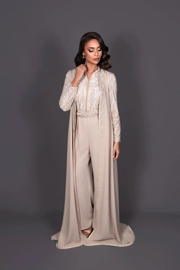 Two-fabric beige Moroccan kaftan jumpsuit in lace and crepe with an artisanal Moroccan belt