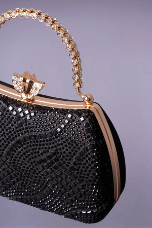 Black and gold evening bag with rhinestones to accessorize a black kaftan