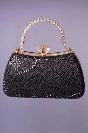 Black and gold rigid evening bag for a black Moroccan kaftan